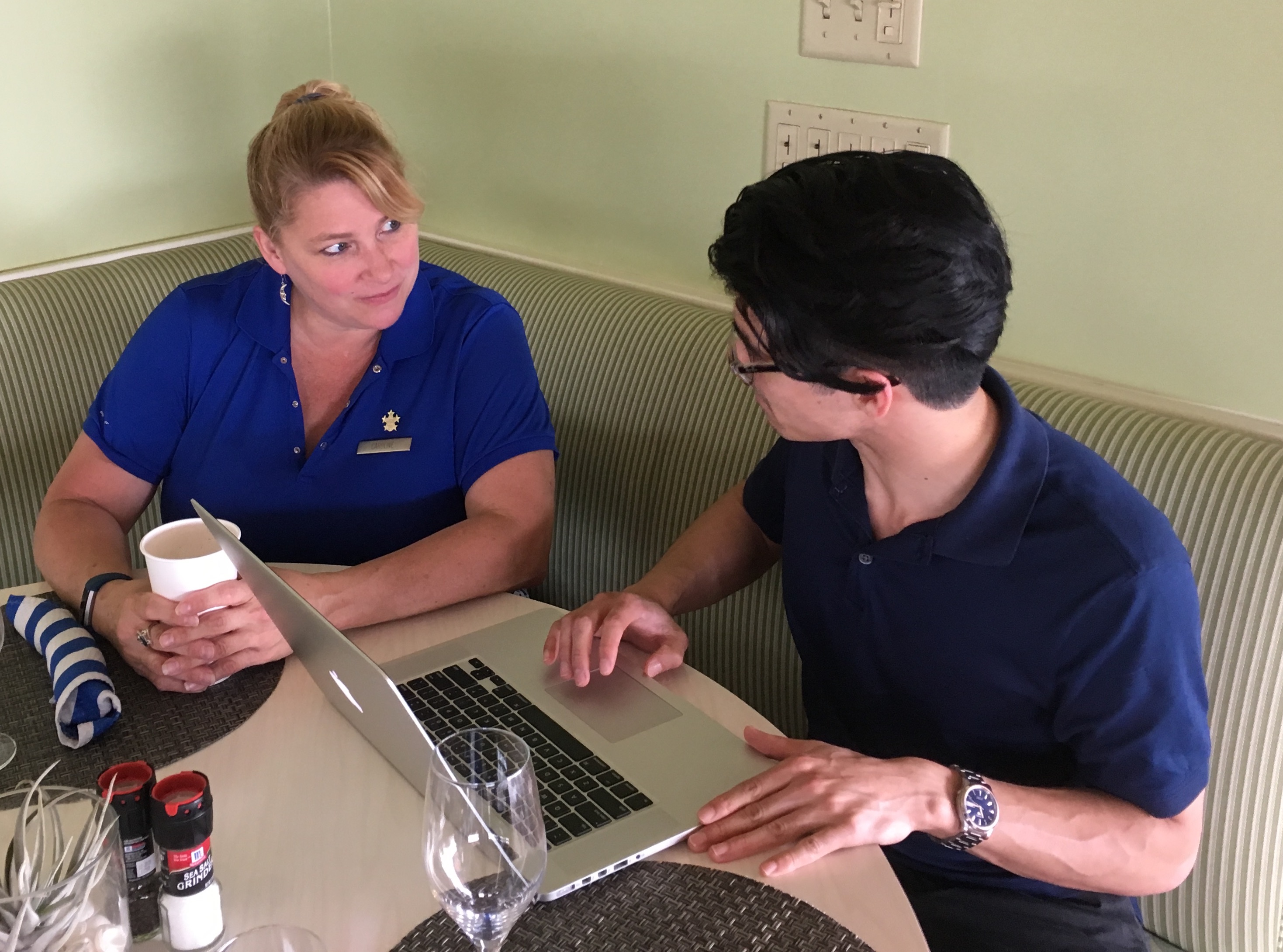 User interview with resort staff member at laptop